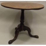 A 19TH CENTURY SNAP TOP SUPPER TABLE raised on turned stem with carved tripod cabriole supports with