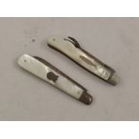 TWO VICTORIAN SILVER AND MOTHER OF PEARL MOUNTED FRUIT KNIVES one with engraved blade and cartouche,