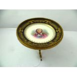 A SEVRES TAZZA hand painted with a portrait of Marie Leczinska, within a gilded cobalt blue rim,