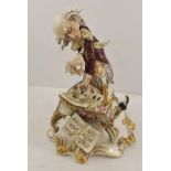 A CAPO DI MONTE PORCELAIN FIGURE 'The Mad Pianist', a gent in red waistcoat on gilded scroll base