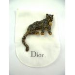 CHRISTIAN DIOR A cast multi blue gem set brooch of a big cat holding a padlock, 12cm wide