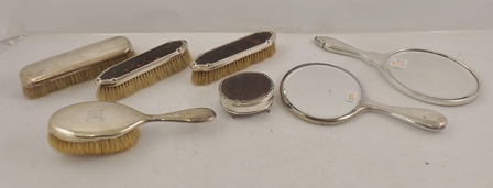 A PART SILVER AND TORTOISESHELL DRESSING TABLE SET comprising; oval hinged lid box, hand vanity
