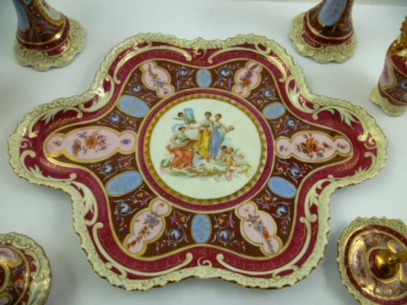 A 20TH CENTURY AUSTRIAN PORCELAIN DRESSING TABLE SET, underglazed banded in red with painted - Image 2 of 3