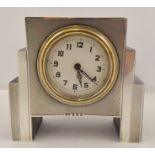 SANDERS AND MACKENZIE AN ART DECO DESIGN SMALL MANTEL CLOCK, silver faced with engine turned