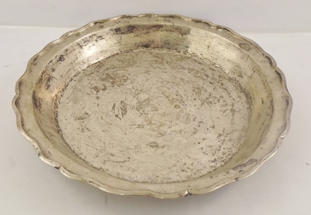 A FOREIGN SILVER COLOURED METAL BOWL/PLATTER having wavy tooled and worked rim, 37cm diameter, 1156g