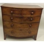 AN EARLY 19TH CENTURY LATE GEORGIAN MAHOGANY BOW FRONTED CHEST having distressed top over two