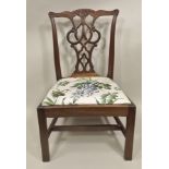 AN EARLY 19TH CENTURY MAHOGANY COUNTRY CHIPPENDALE STYLE CHILD'S CHAIR having carved and fretted