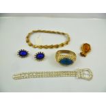 A SUITE OF JEWELLERY comprising; a Trifari gilt metal necklace, buckle bracelet bangle, a pair of