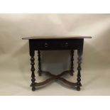 A GEORGE II DESIGN OAK SIDE TABLE fitted single drawer with brass ring handles, on turned supports