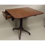 A PROBABLY EARLY 20TH CENTURY VICTORIAN STYLE SIDE TABLE having 19th century top with dropflap