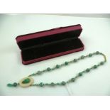 A 1920's PEKING GLASS & MOSAIC MALACHITE EFFECT NECKLACE with pendant drop, 60cm long