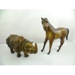 TWO EARLY 20TH CENTURY LEATHER COVERED MODEL ANIMALS, one standing horse, the other being a four