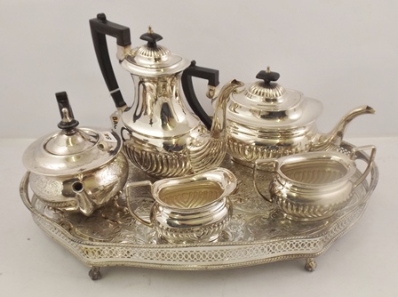 A SILVER PLATED "ASHBERRY" FOUR PIECE TEA AND COFFEE SET of Georgian fluted design, together with