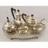 A SILVER PLATED "ASHBERRY" FOUR PIECE TEA AND COFFEE SET of Georgian fluted design, together with