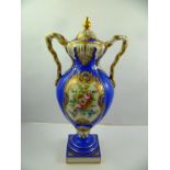 A LATE 19TH/EARLY 20TH CENTURY CONTINENTAL PORCELAIN LIDDED VASE having twin sphinx handles,