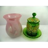 A 20TH CENTURY GREEN GLASS BISCUIT BARREL, COVER AND DISH, each decorated with white scrolls and