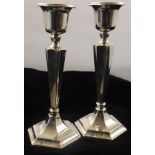 A PAIR OF SILVER TAPER CANDLESTICKS of Georgian design, hexagonal tapering stems on a weighted