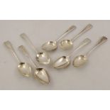 A SUITE OF SEVEN OLD ENGLISH PATTERN GEORGIAN SILVER DESSERT SPOONS each with monogrammed 'L', mixed