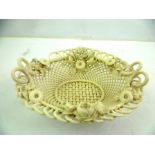 A VICTORIAN STYLE PORCELAIN BASKET, matt finished white lattice work and applied with flora, 20 x