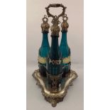 VICTORIAN SHEFFIELD PLATE WINE BOTTLE CARRIER, raised on fruiting vine feet with central carrying