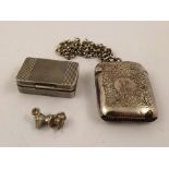 A SILVER VESTA CASE monogrammed H on modern trace pattern silver chain, another engine turned