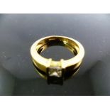 AN 18CT GOLD RING set with a solitaire diamond