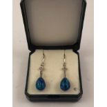 A PAIR OF RHODIUM FINISHED WHITE GOLD COLOURED METAL DIAMOND & OPAL DROP EARRINGS each having wire