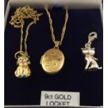 A 9CT GOLD AND ENAMEL PENDANT fashioned as a seated cat on chain, a 9ct LOCKET fashioned as a seated