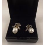 A PAIR OF VICTORIAN STYLE DIAMOND & PEARL DROP EARRINGS each having a bow shaped front, set