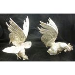 A PAIR OF SILVER PLATED FIGHTING COCKERELS, 24cm high