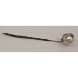 AN 18TH CENTURY TODDY LADLE with whalebone handle, inset Queen Anne coin 1709, 35cm long