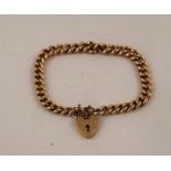 A 9CT GOLD HEAVY LINK CHAIN BRACELET with 9ct gold padlock clasp, 29g