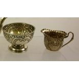 A VICTORIAN EMBOSSED SILVER CREAM JUG, Sheffield 1891, together with an embossed SILVER BOWL,