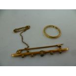 A 9CT. GOLD WEDDING BAND, size O, and a gold coloured metal sapphire and diamond BAR BROOCH set with