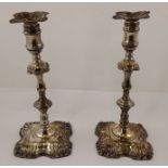 A PAIR OF LATE GEORGIAN/EARLY VICTORIAN SHEFFIELD PLATE CANDLE STICKS each having quatrefoil scallop