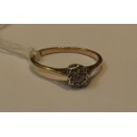 A DIAMOND ILLUSION SET SOLITAIRE in 9ct gold setting, Birmingham assay, size R