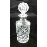 A LEAD CRYSTAL CUT GLASS DECANTER with silver collar and cut glass stopper, Birmingham 1974