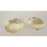 HORACE WOODWARD A PAIR OF SILVER SCALLOP PATTERN BUTTER DISHES, each raised on three ball feet,