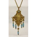 AN EARLY 20TH CENTURY ART NOUVEAU INFLUENCED PENDANT NECKLACE with female mask head and turquoise
