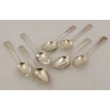 A SUITE OF SEVEN OLD ENGLISH PATTERN GEORGIAN SILVER DESSERT SPOONS each monogrammed 'L', mixed