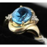 A 9CT GOLD BLUE TOPAZ AND DIAMOND RING, size L 1/2, boxed