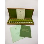 JOHN PINCHES LTD. A SET OF TWELVE "ROYAL HORTICULTURAL SOCIETY" SPONSORED SILVER "FLOWER" TEASPOONS,