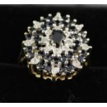 A 9CT. GOLD SAPPHIRE AND DIAMOND CLUSTER RING, size P easy, boxed