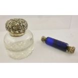 A VICTORIAN BLUE GLASS AND SILVER DOUBLE ENDED SCENT BOTTLE with pressed decoration, 10cm long and a