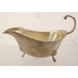 BISHTONS LIMITED A SILVER SAUCE BOAT, having cut crimped rim, up-scroll handle, and raised on