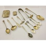 A SELECTION OF MISCELLANEOUS SILVER ITEMS, to include tablespoon, tongs, cigarette case, vesta