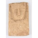 A near Eastern Arabian limestone carved stele decorative plaque with carved stylised head to upper