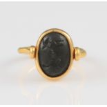A Sassanid seal swivel ring, mounted into later mount and tapered ring body, seal intaglio featuring