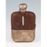 A 20th Century glass hip flask, with silver lid and base, the rectangular body having crocodile skin
