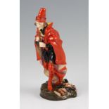 A Royal Doulton figure ‘The Pied Piper’ HN 1215, dressed in red and black holding a pipe on a